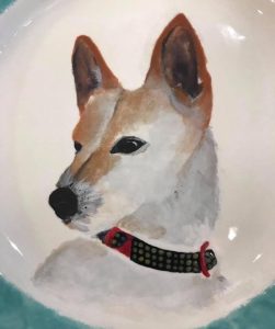 detail of dog portrait on a plate