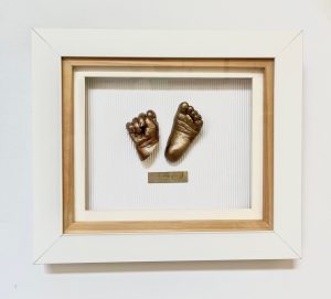 Bronze Casts In A White Frame