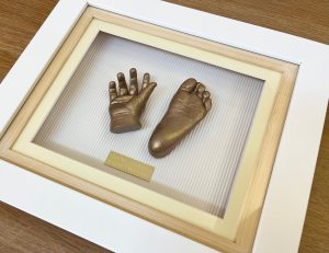 Bronze casts In A White Frame